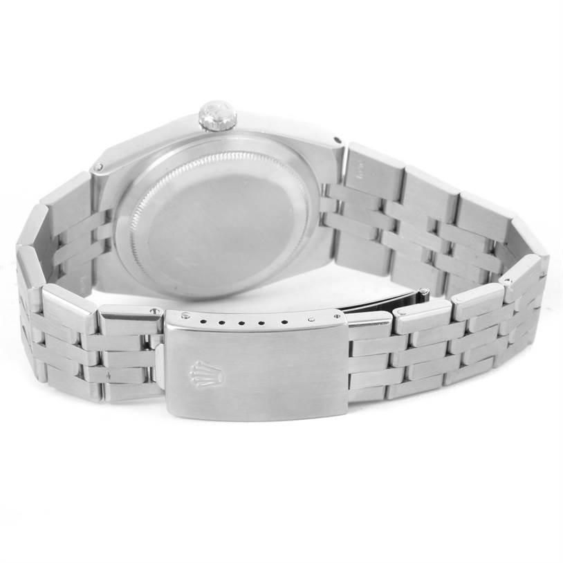 The image shows the back view of the Rolex Oysterquartz 17014 Men's Stainless Steel White Dial 17014 Men's Stainless Steel White Dial watch, highlighting the case back and the metal bracelet with the clasp.