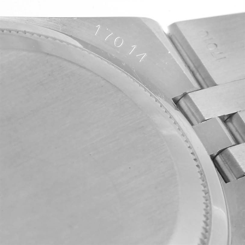 The image shows the case back and part of the bracelet of the Rolex Oysterquartz 17014 Men's Stainless Steel White Dial 17014 Men's Stainless Steel White Dial model, with the model number "17014" engraved.