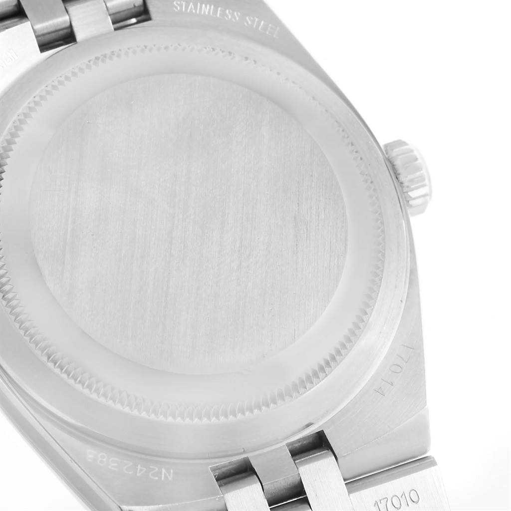 The image shows the case back and part of the bracelet of a Rolex Oysterquartz 17014 Men's Stainless Steel White Dial 17014 Men's Stainless Steel White Dial watch, viewed from the rear.