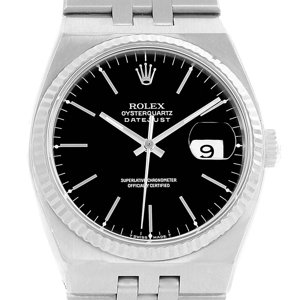 The image shows a frontal view of a Rolex Oysterquartz 17014 Men's Stainless Steel White Dial 17014 Men's Stainless Steel White Dial Datejust watch, focusing on its black dial, silver markers, and date window.