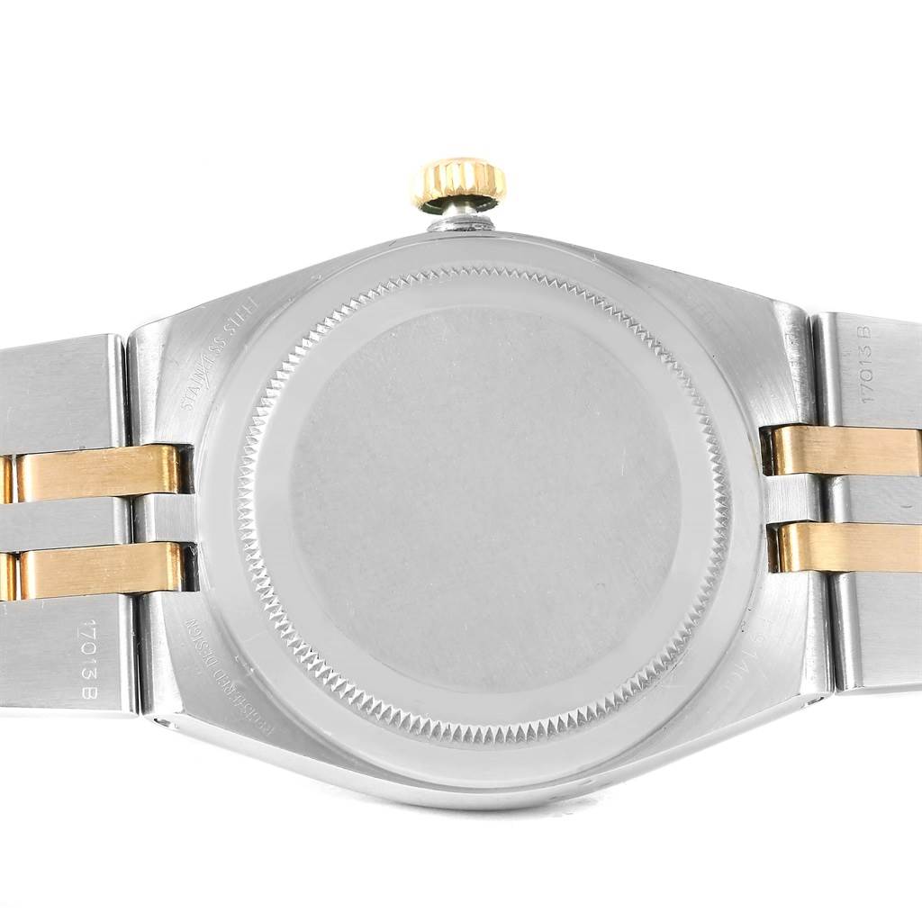 The image shows the backside of a Rolex Oysterquartz 17013 Men's Stainless Steel Champagne Dial 17013 Men's Stainless Steel Champagne Dial, highlighting the case back, crown, and a part of the bracelet.