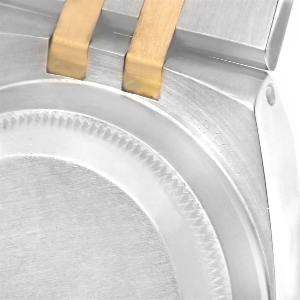 The image shows a close-up of the case back and two-tone bracelet of a Rolex Oysterquartz 17013 Men's Stainless Steel Champagne Dial 17013 Men's Stainless Steel Champagne Dial model.