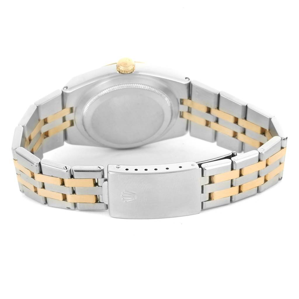 This image shows the back view of the Rolex Oysterquartz 17013 Men's Stainless Steel Champagne Dial 17013 Men's Stainless Steel Champagne Dial watch, highlighting the case back, crown, and two-tone bracelet with clasp.