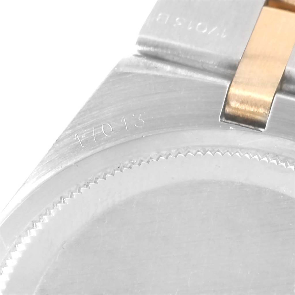 This image shows a close-up of the Rolex Oysterquartz 17013 Men's Stainless Steel Champagne Dial 17013 Men's Stainless Steel Champagne Dial model, focusing on the case back and bracelet.