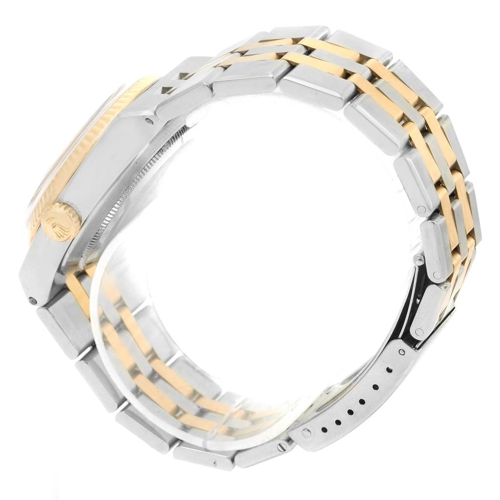 The image shows a side view of a Rolex Oysterquartz 17013 Men
s Stainless Steel Champagne Dial 17013 Men
s Stainless Steel Champagne Dial watch, highlighting its case and two-tone metal bracelet.