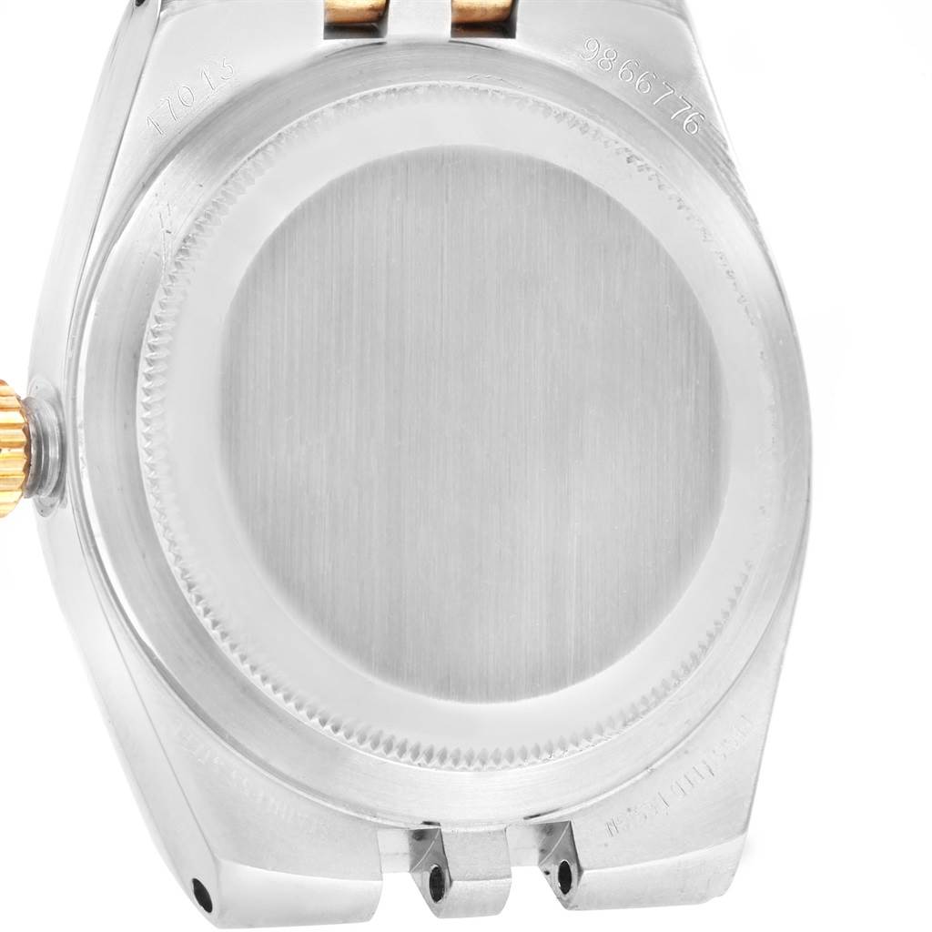 This image shows the back case of a Rolex Oysterquartz 17013 Men
s Stainless Steel Champagne Dial 17013 Men
s Stainless Steel Champagne Dial watch from a bottom-up angle.