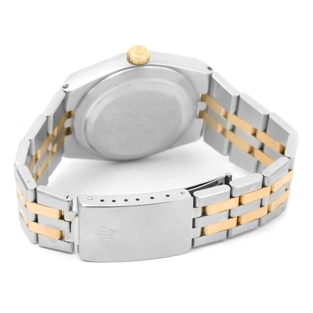 The image shows the back of the Rolex Oysterquartz 17013 Men
s Stainless Steel Champagne Dial 17013 Men
s Stainless Steel Champagne Dial watch, including its case, crown, and two-tone metal bracelet with deployant clasp.