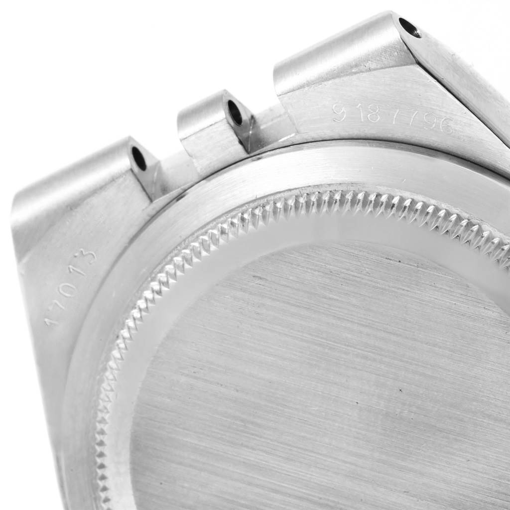 The image shows a close-up of the backside and lugs of a Rolex Oysterquartz 17013 Men's Stainless Steel White Dial 17013 Men's Stainless Steel White Dial watch case.