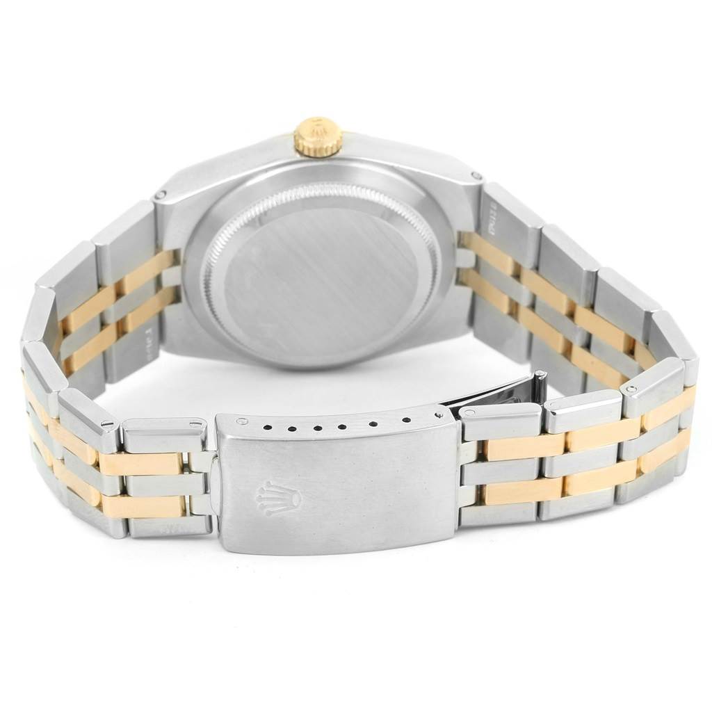 The image shows the backside and clasp of a Rolex Oysterquartz 17013 Men's Stainless Steel White Dial 17013 Men's Stainless Steel White Dial watch, highlighting its two-tone bracelet and case back.