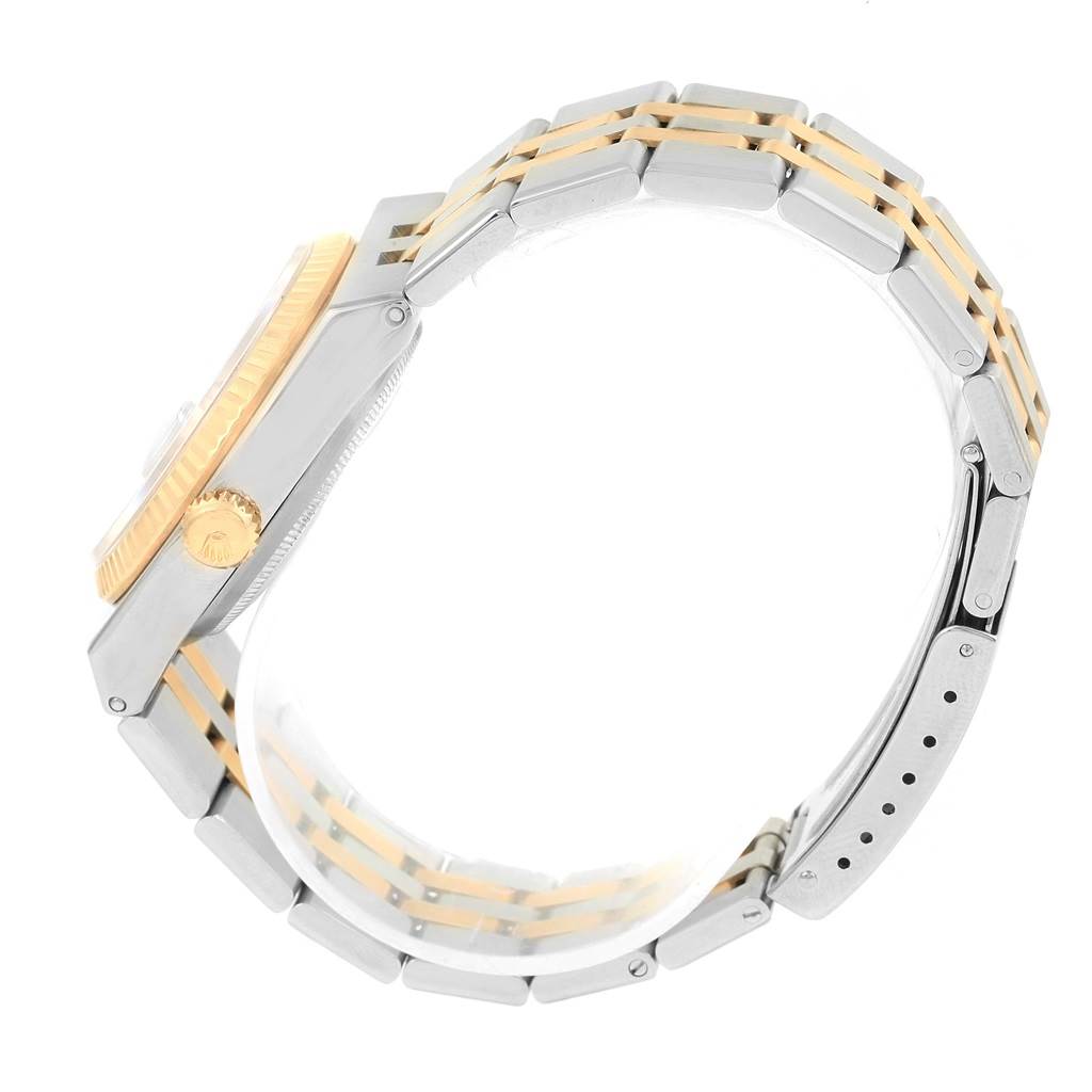 The image shows a side view of the Rolex Oysterquartz 17013 Men
s Stainless Steel Black Dial 17013 Men
s Stainless Steel Black Dial model, highlighting its two-tone bracelet and crown.