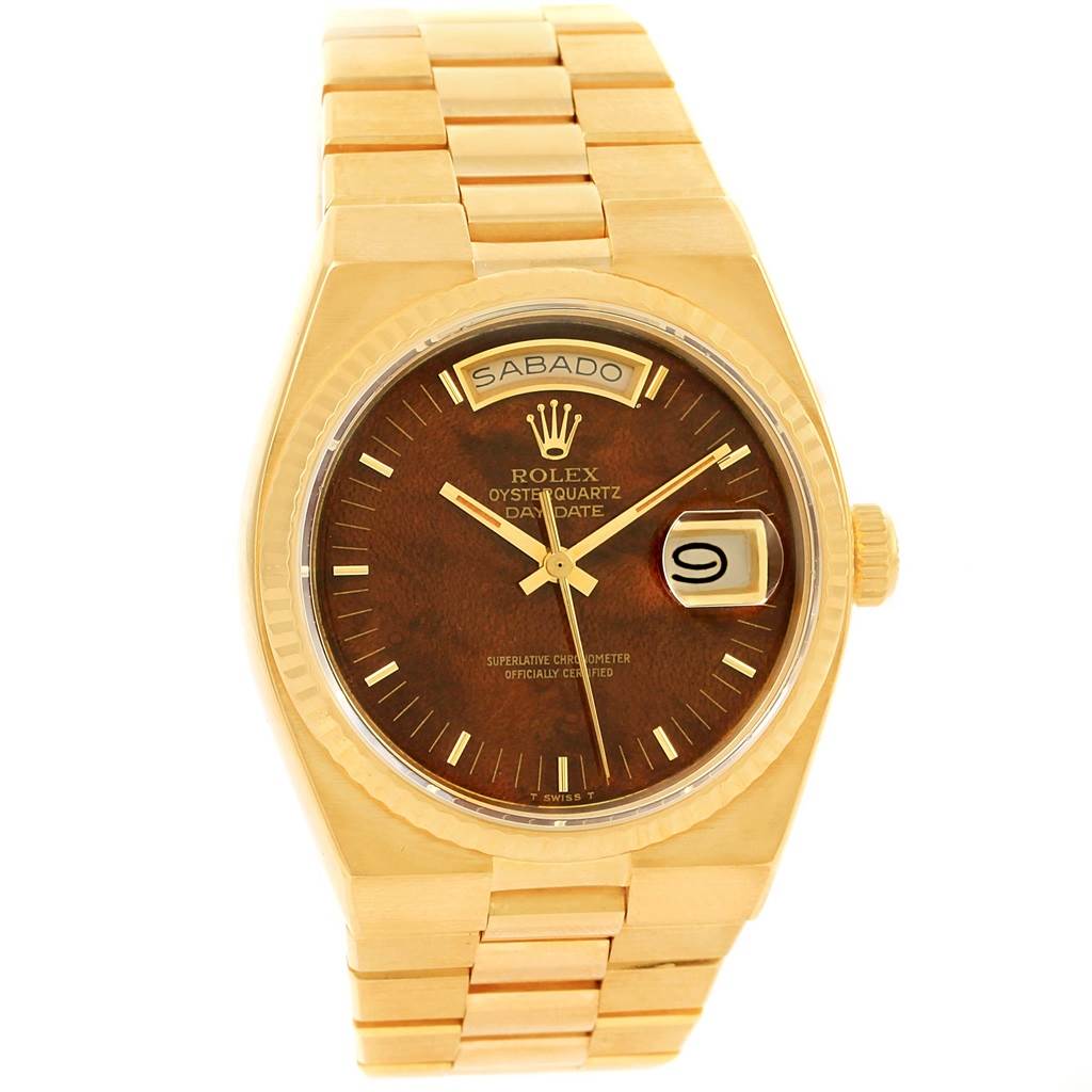 The image shows a frontal view of a Rolex Oysterquartz 19018 Men's Stainless Steel Brown Dial 19018 Men's Stainless Steel Brown Dial watch, highlighting the brown dial, day-date feature, and gold bracelet.