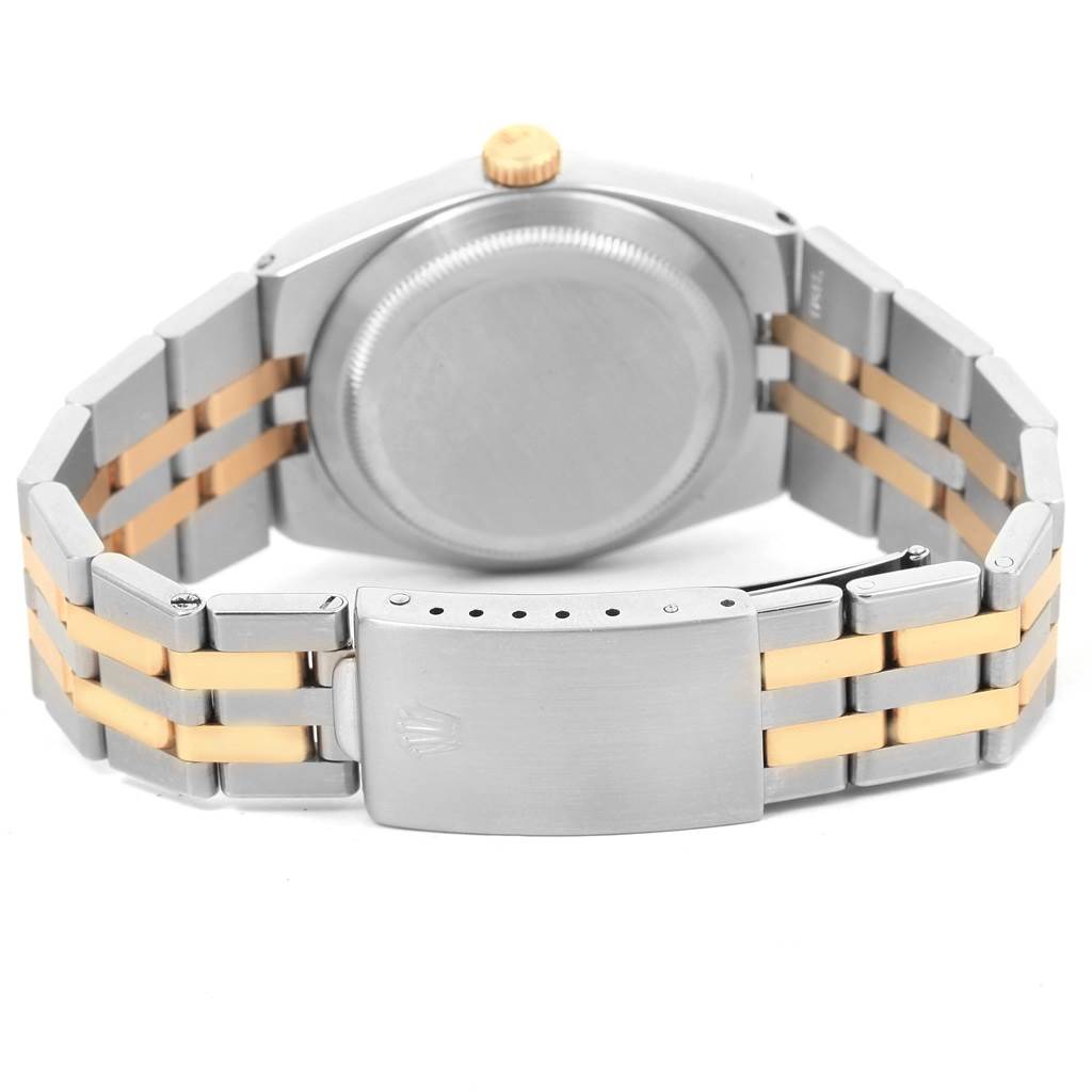 The image shows the back view of a Rolex Oysterquartz 17013 Men
s Stainless Steel White Dial 17013 Men
s Stainless Steel White Dial watch, highlighting the case, crown, and two-tone bracelet with the clasp.