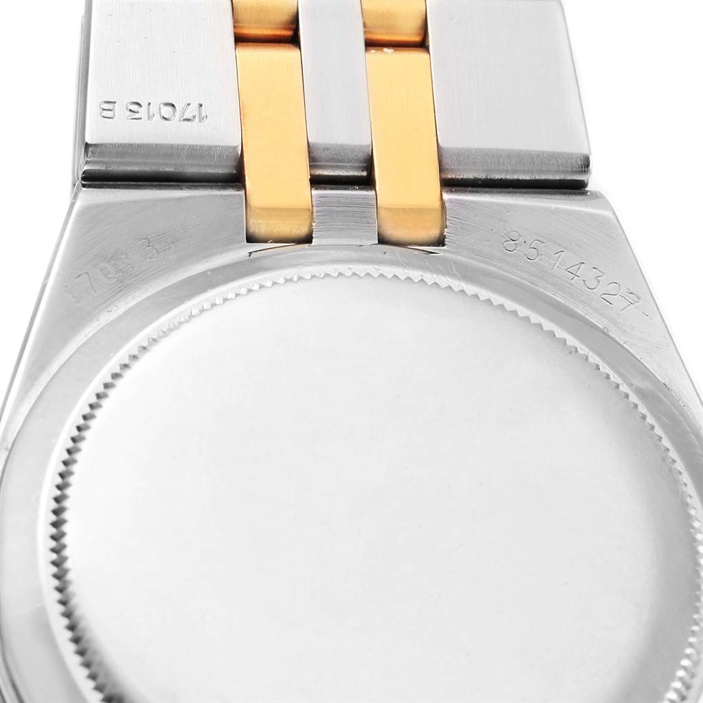This image shows the back casing and part of the bracelet of a Rolex Oysterquartz 17013 Men's Stainless Steel White Dial 17013 Men's Stainless Steel White Dial model watch, including serial numbers.