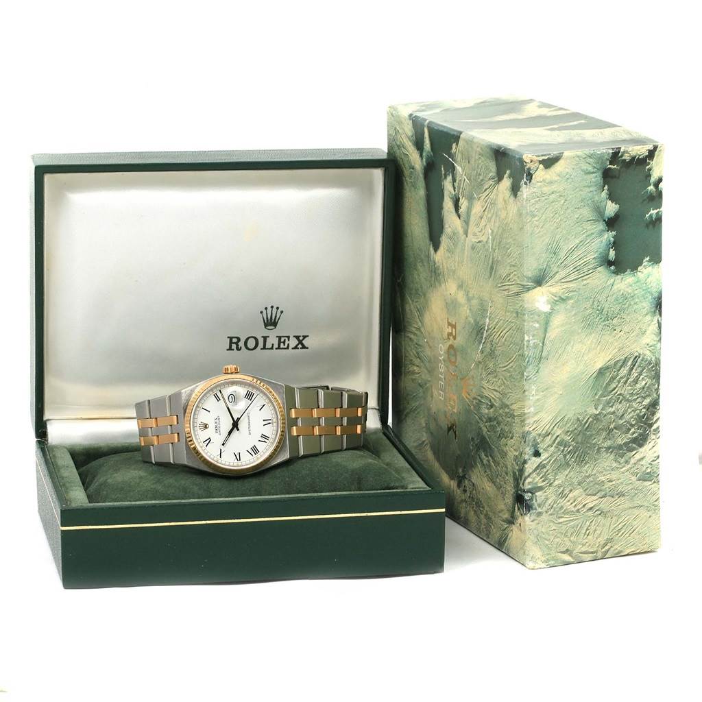This image shows a Rolex Oysterquartz 17013 Men's Stainless Steel White Dial 17013 Men's Stainless Steel White Dial watch front-facing in its open box alongside its packaging.