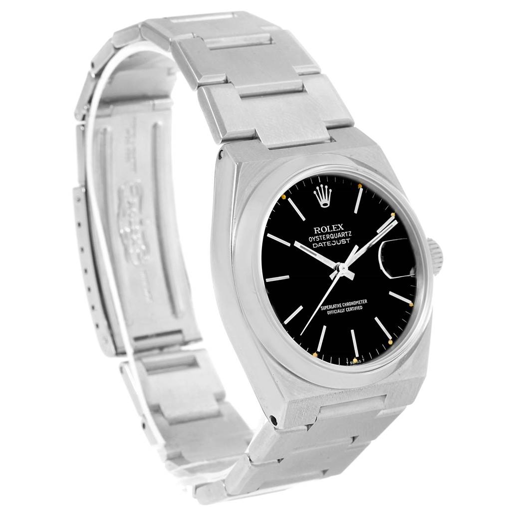 The image shows a Rolex Oysterquartz 17000 Men
s Stainless Steel Black Dial 17000 Men
s Stainless Steel Black Dial Datejust watch at a three-quarter angle, highlighting its black dial, stainless steel bracelet, and case.