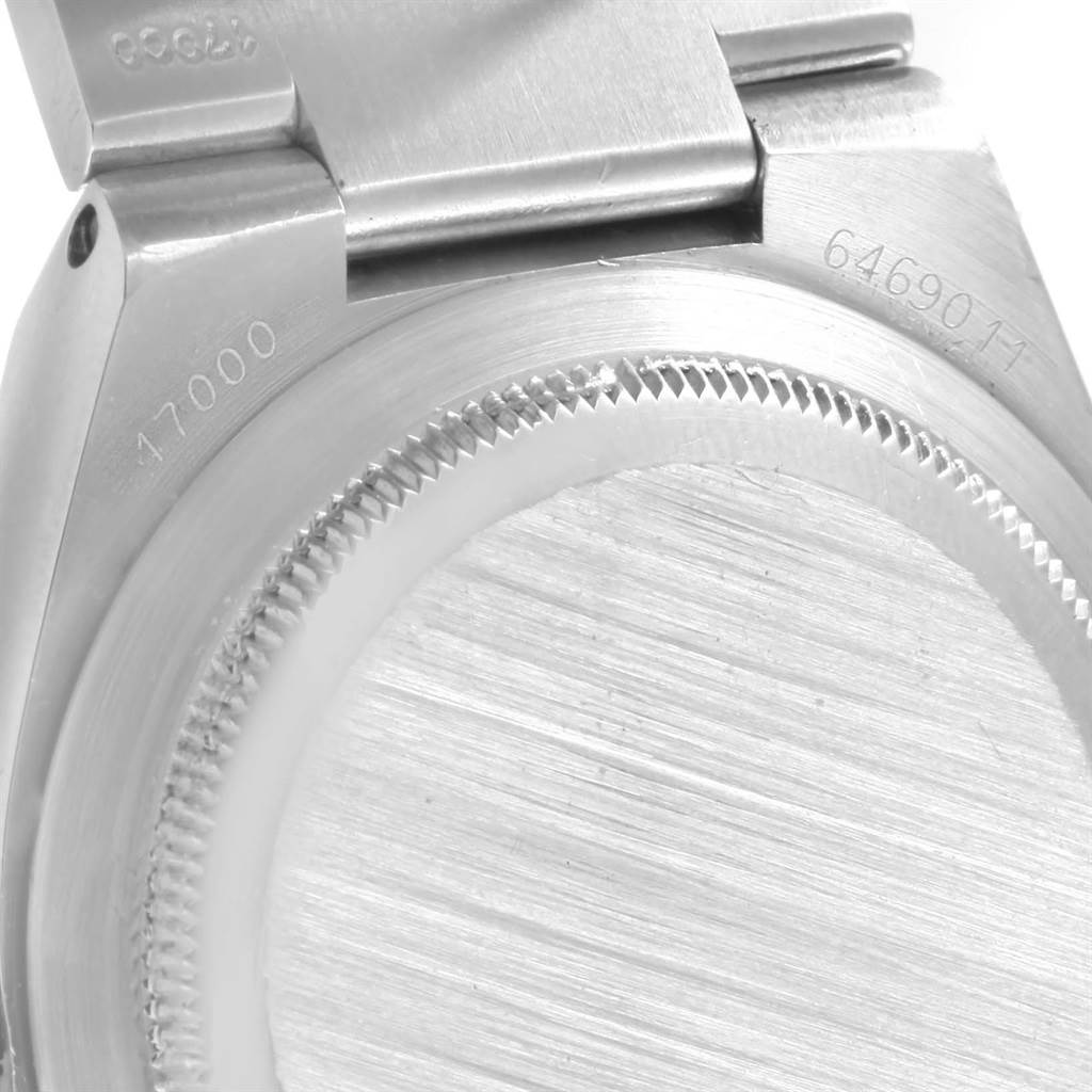 The image shows a close-up of the back case and part of the clasp of a Rolex Oysterquartz 17000 Men
s Stainless Steel Black Dial 17000 Men
s Stainless Steel Black Dial watch.