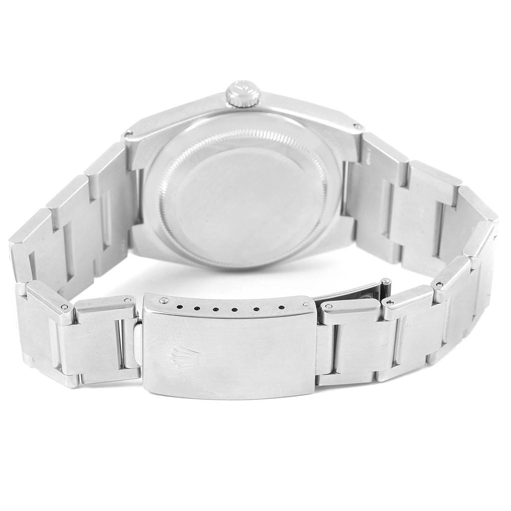 The image shows a rear view of a Rolex Oysterquartz 17000 Men's Stainless Steel White Dial 17000 Men's Stainless Steel White Dial model, focusing on the case back and bracelet clasp.