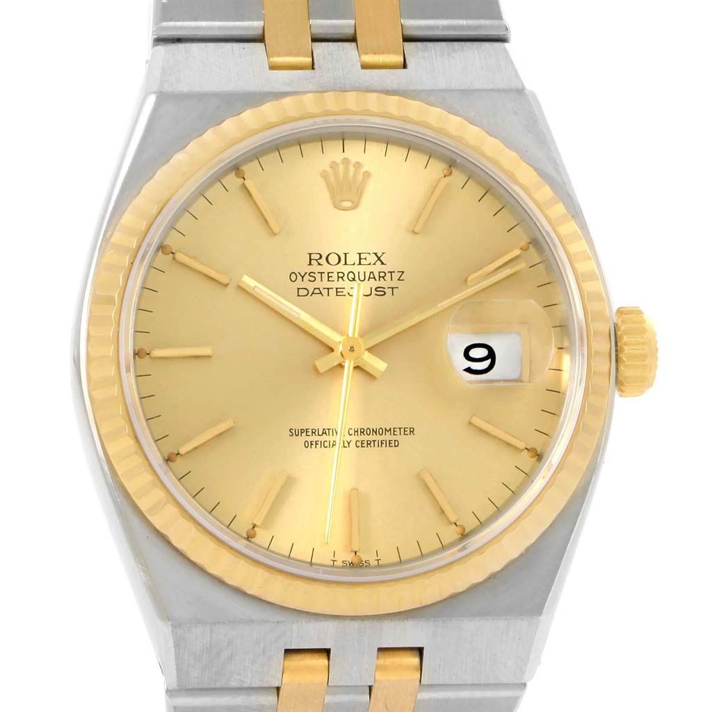 This image shows a front view of a Rolex Oysterquartz 17013 Men's Stainless Steel Champagne Dial 17013 Men's Stainless Steel Champagne Dial Datejust watch, highlighting its dial, bezel, and part of the bracelet.