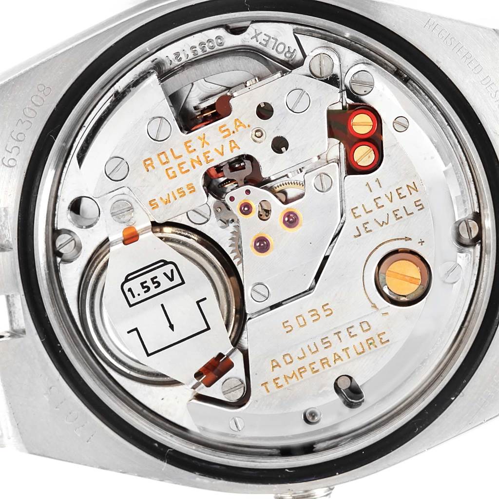 The image shows a Rolex Oysterquartz 17013 Men's Stainless Steel Champagne Dial 17013 Men's Stainless Steel Champagne Dial watch movement from a back view, highlighting the internal mechanism and battery.