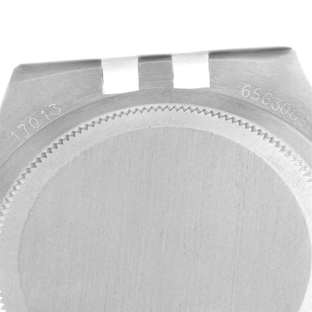 The image shows a close-up of the case back and model number engraving of a Rolex Oysterquartz 17013 Men's Stainless Steel Champagne Dial 17013 Men's Stainless Steel Champagne Dial watch.