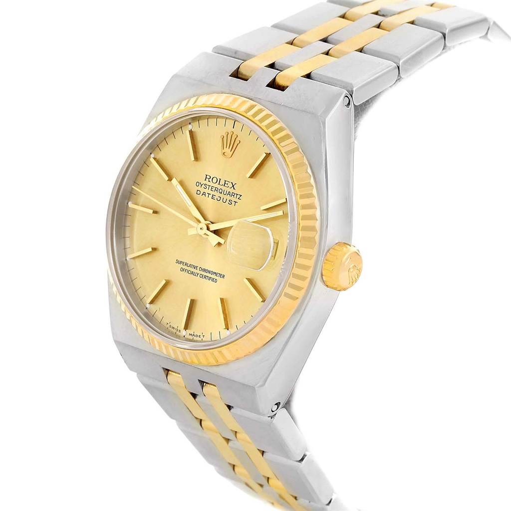 The Rolex Oysterquartz 17013 Men's Stainless Steel Champagne Dial 17013 Men's Stainless Steel Champagne Dial watch is shown at a slight angle, clearly displaying its dial, fluted bezel, and two-tone bracelet.