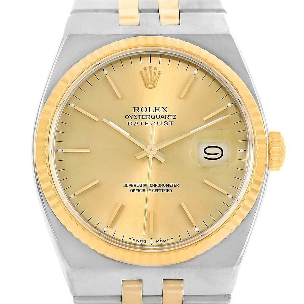 This image shows a front view of the Rolex Oysterquartz 17013 Men's Stainless Steel Champagne Dial 17013 Men's Stainless Steel Champagne Dial Datejust watch, highlighting the dial, hands, date window, and part of the bracelet.