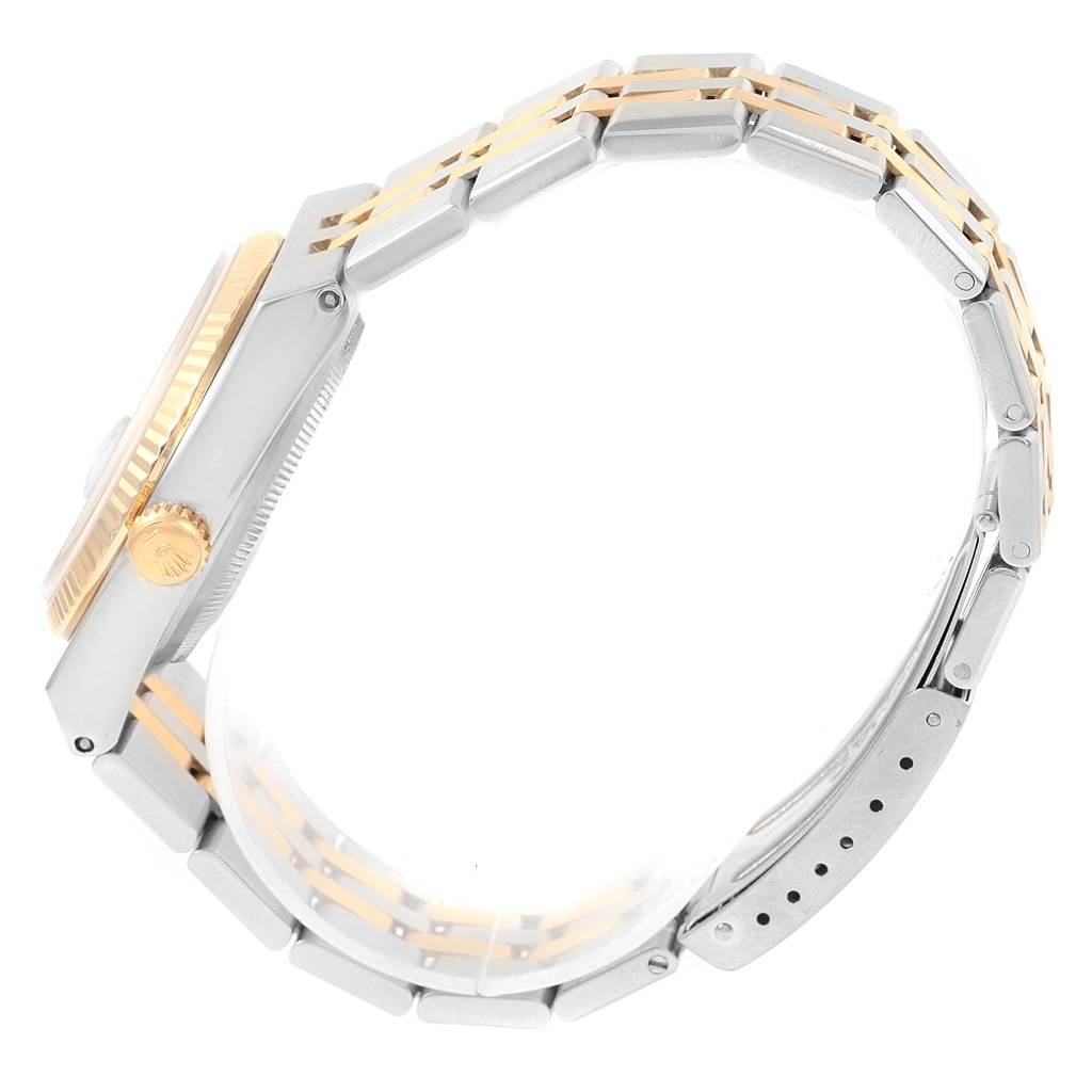 The image shows a side view of a Rolex Oysterquartz 17013 Men's Stainless Steel Champagne Dial 17013 Men's Stainless Steel Champagne Dial watch highlighting the crown, bezel, and bracelet.