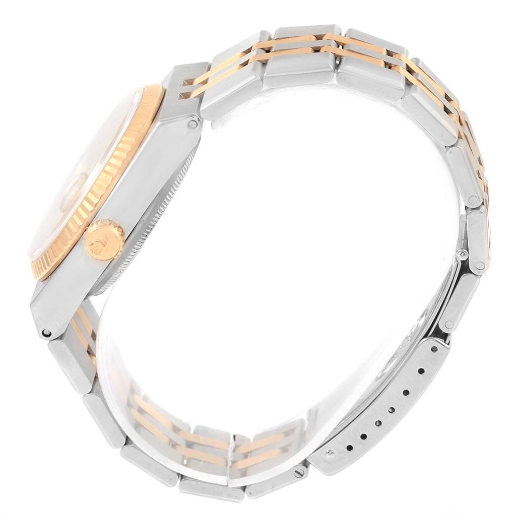 The image shows a side view of the Rolex Oysterquartz 17013 Men
s Stainless Steel Champagne Dial 17013 Men
s Stainless Steel Champagne Dial watch, highlighting its case, crown, bezel, and two-tone bracelet.