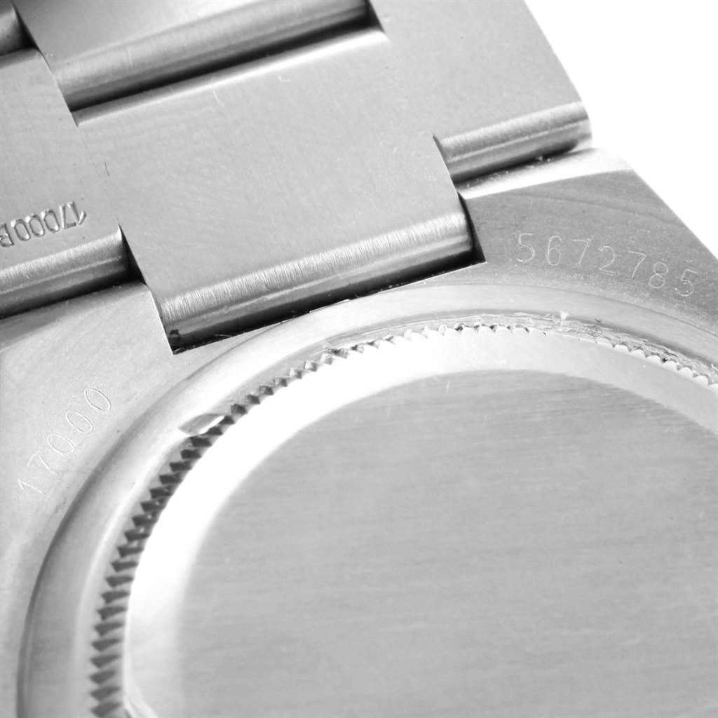 This image shows a close-up of the case back and part of the bracelet of a Rolex Oysterquartz 17000 Men's Stainless Steel White Dial 17000 Men's Stainless Steel White Dial watch, highlighting serial numbers.