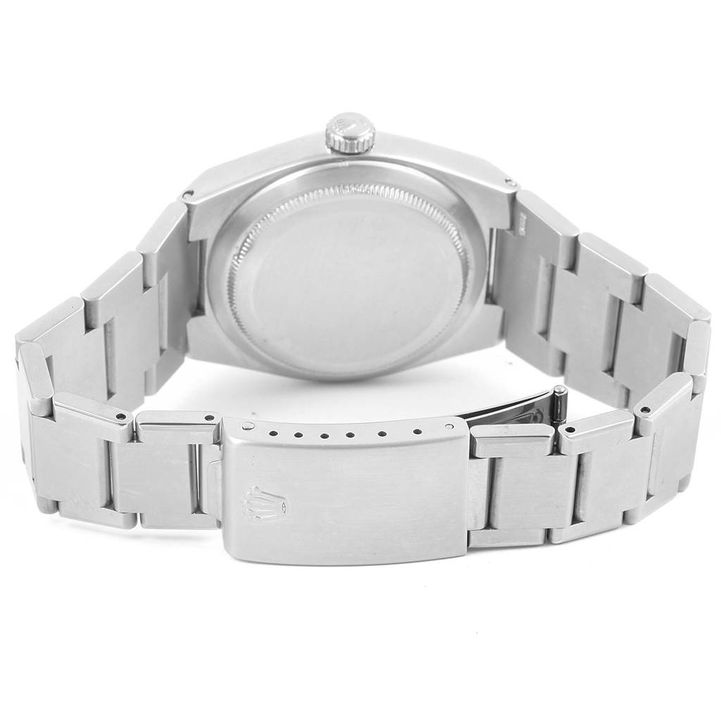 This image shows the back case, crown, and bracelet clasp of a Rolex Oysterquartz 17000 Men's Stainless Steel White Dial 17000 Men's Stainless Steel White Dial watch.