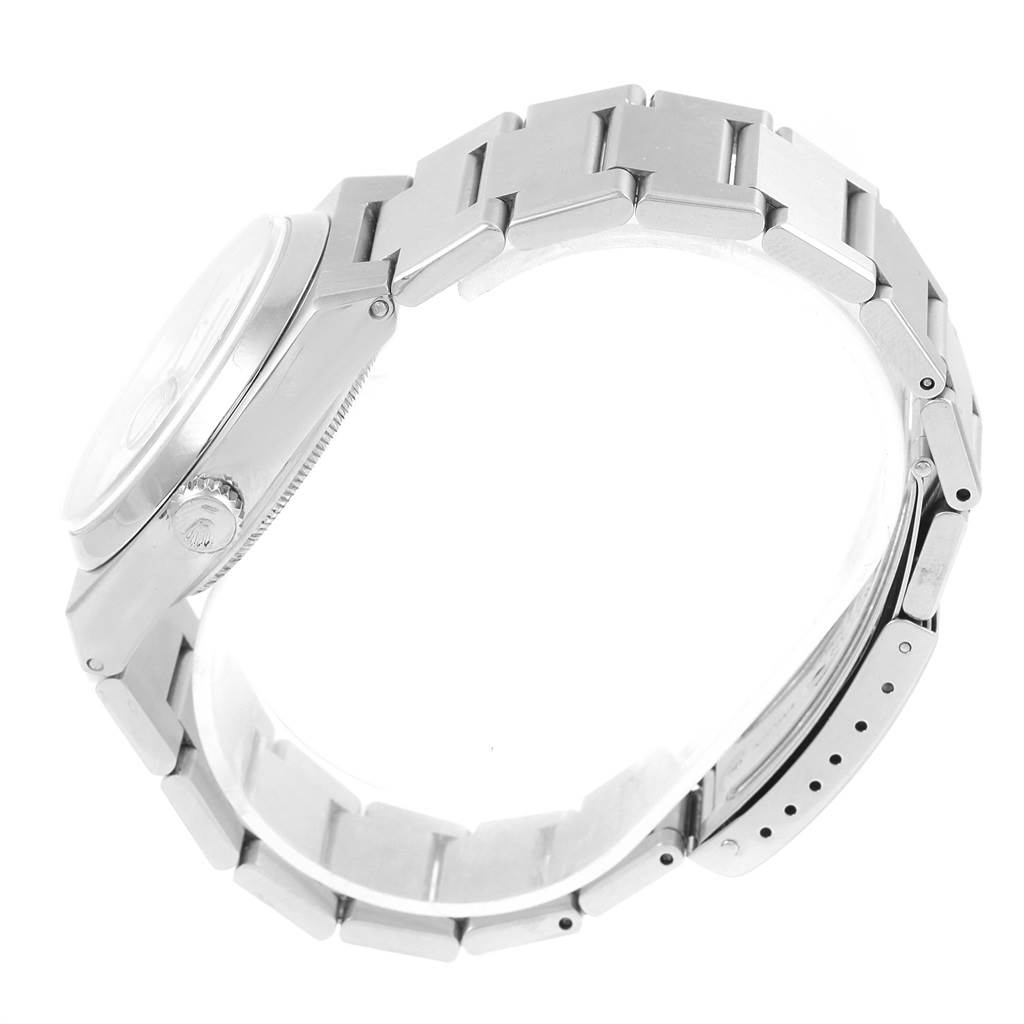 The Rolex Oysterquartz 17000 Men's Stainless Steel White Dial 17000 Men's Stainless Steel White Dial watch is shown from a side angle, highlighting its profile and bracelet links.