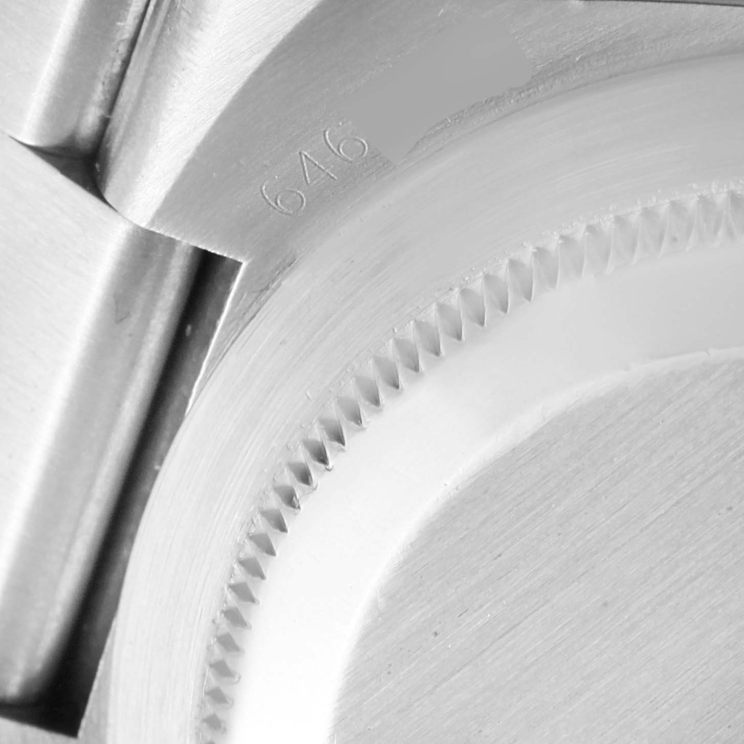 The image shows a close-up of the case and bracelet attachment point with a part number on a Rolex Oysterquartz 17000 Men's Stainless Steel Black Dial 17000 Men's Stainless Steel Black Dial watch.