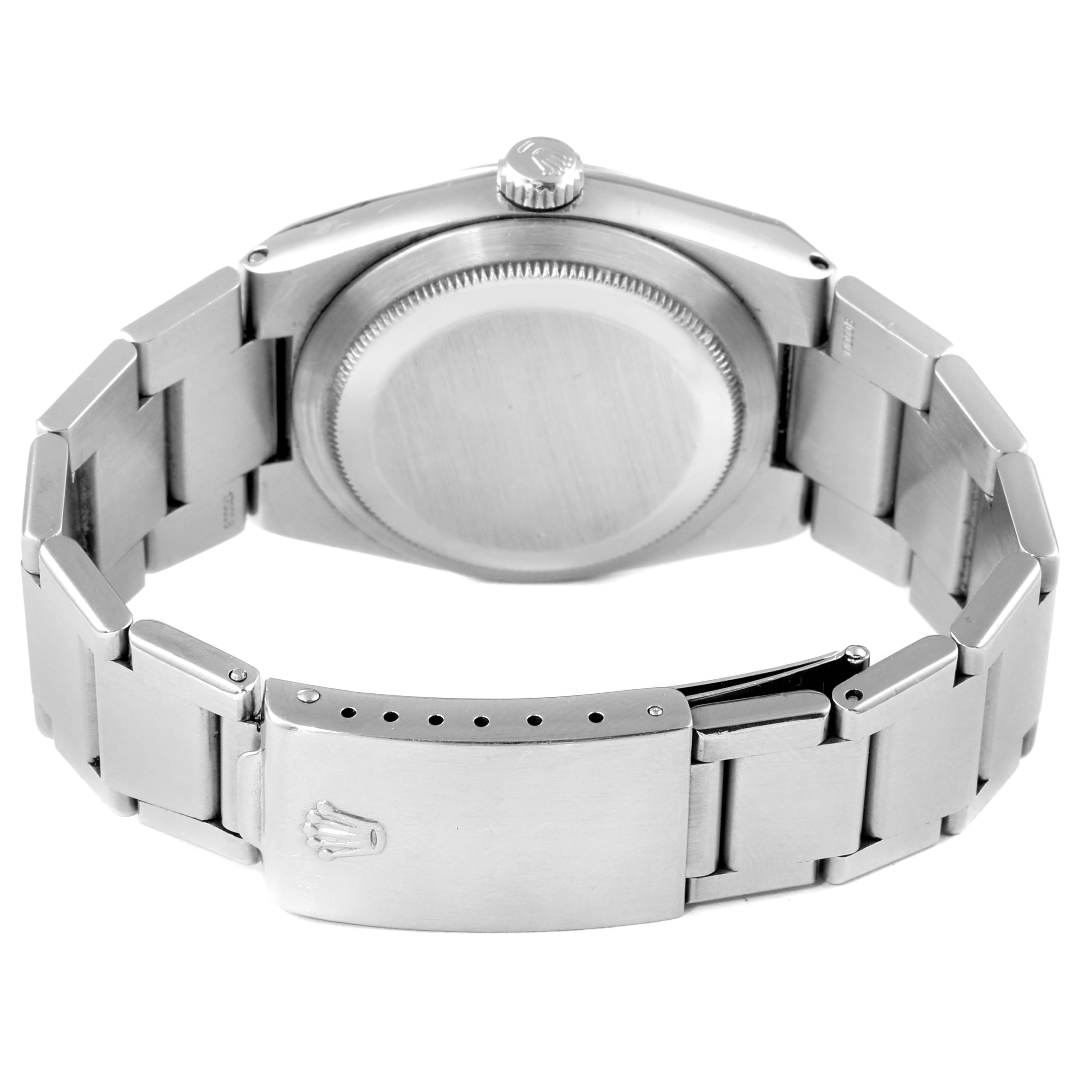 The image shows the back view of the Rolex Oysterquartz 17000 Men's Stainless Steel Black Dial 17000 Men's Stainless Steel Black Dial watch, highlighting its case back, bracelet, and clasp.