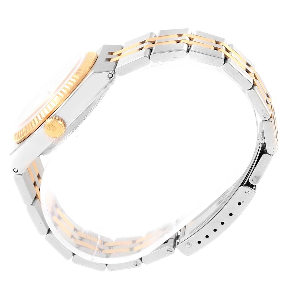 The image shows a side view of the Rolex Oysterquartz 17013 Men's Stainless Steel White Dial 17013 Men's Stainless Steel White Dial watch, highlighting the crown, bezel, and bracelet.