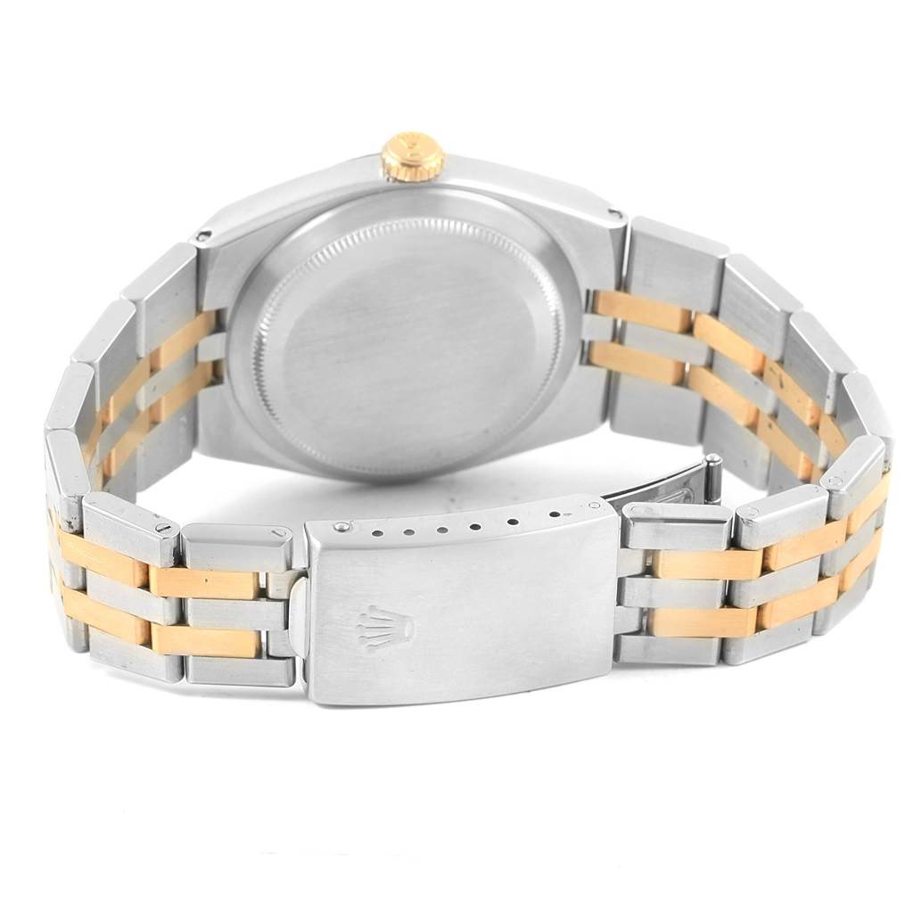 The image shows the back view of a Rolex Oysterquartz 17013 Men's Stainless Steel White Dial 17013 Men's Stainless Steel White Dial watch, highlighting the case, band, clasp, and crown.