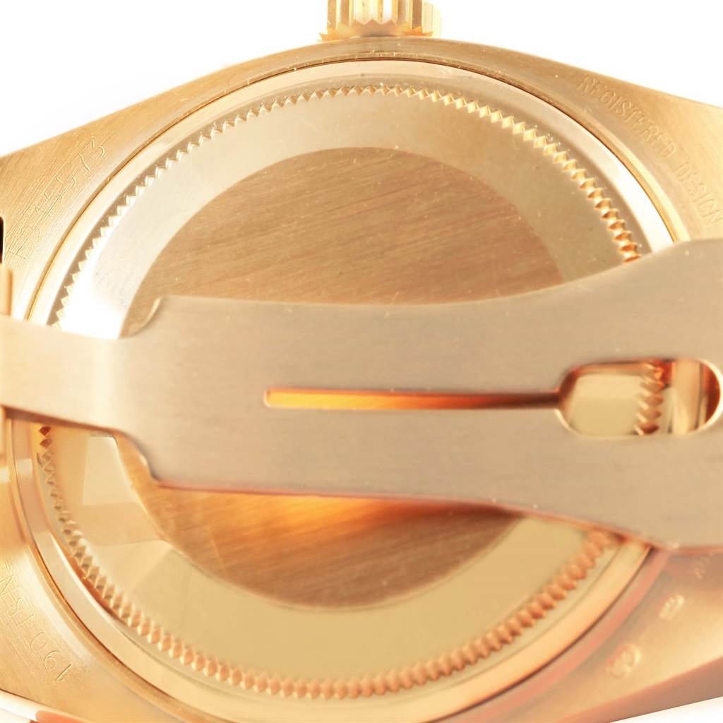 This close-up image shows the back case and clasp mechanism of a Rolex Oysterquartz 19018 Men's Yellow Gold Champagne Dial 19018 Men's Yellow Gold Champagne Dial watch.