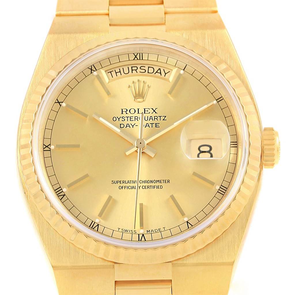 The image shows a front view of the Rolex Oysterquartz 19018 Men's Yellow Gold Champagne Dial 19018 Men's Yellow Gold Champagne Dial watch, highlighting its gold dial, day-date display, and case.
