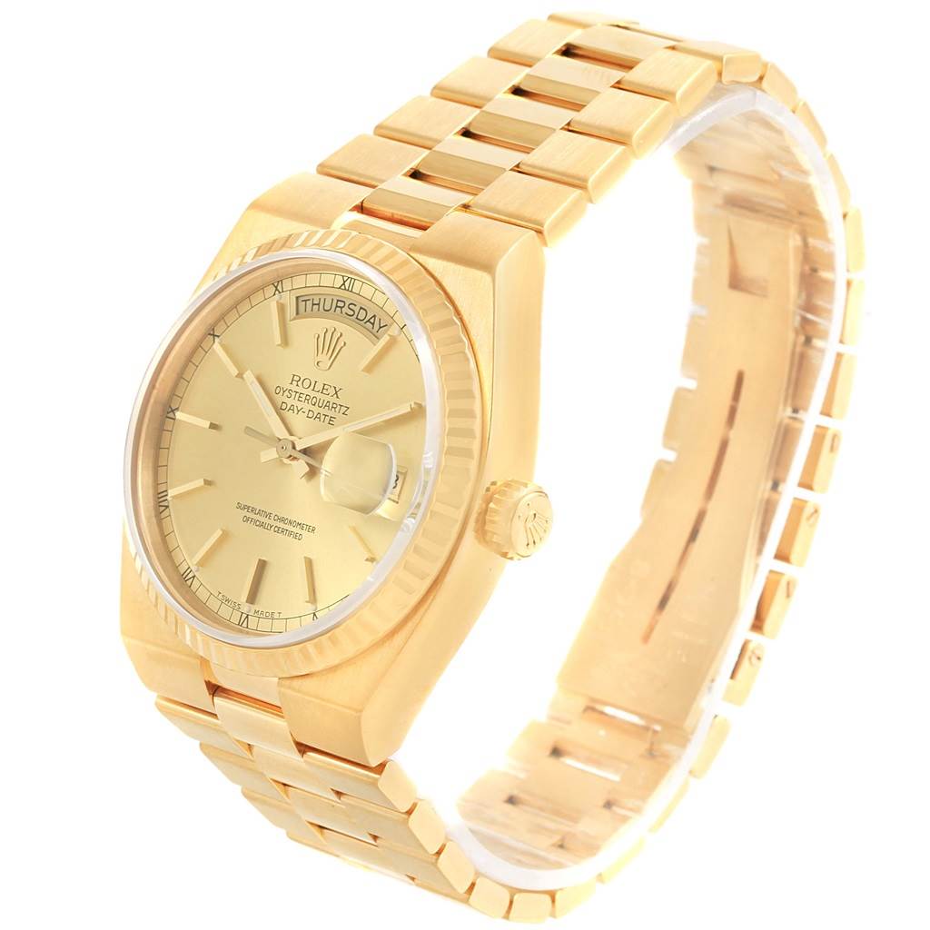 The image shows a Rolex Oysterquartz 19018 Men's Yellow Gold Champagne Dial 19018 Men's Yellow Gold Champagne Dial Day-Date watch angled from the front-right, displaying the dial, bezel, crown, and bracelet.