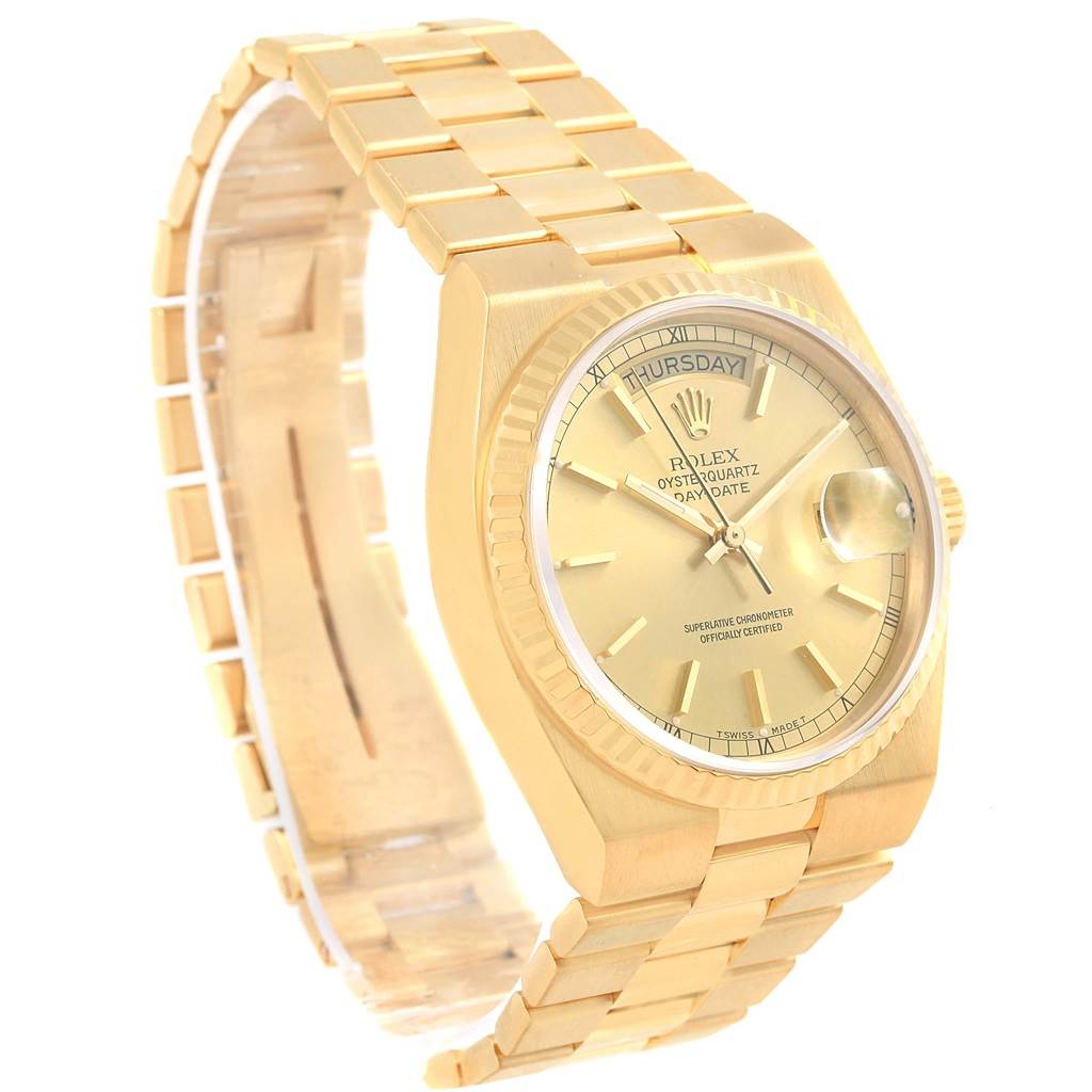 This image shows a Rolex Oysterquartz 19018 Men's Yellow Gold Champagne Dial 19018 Men's Yellow Gold Champagne Dial watch at a 3/4 angle highlighting the bracelet, dial, and case.