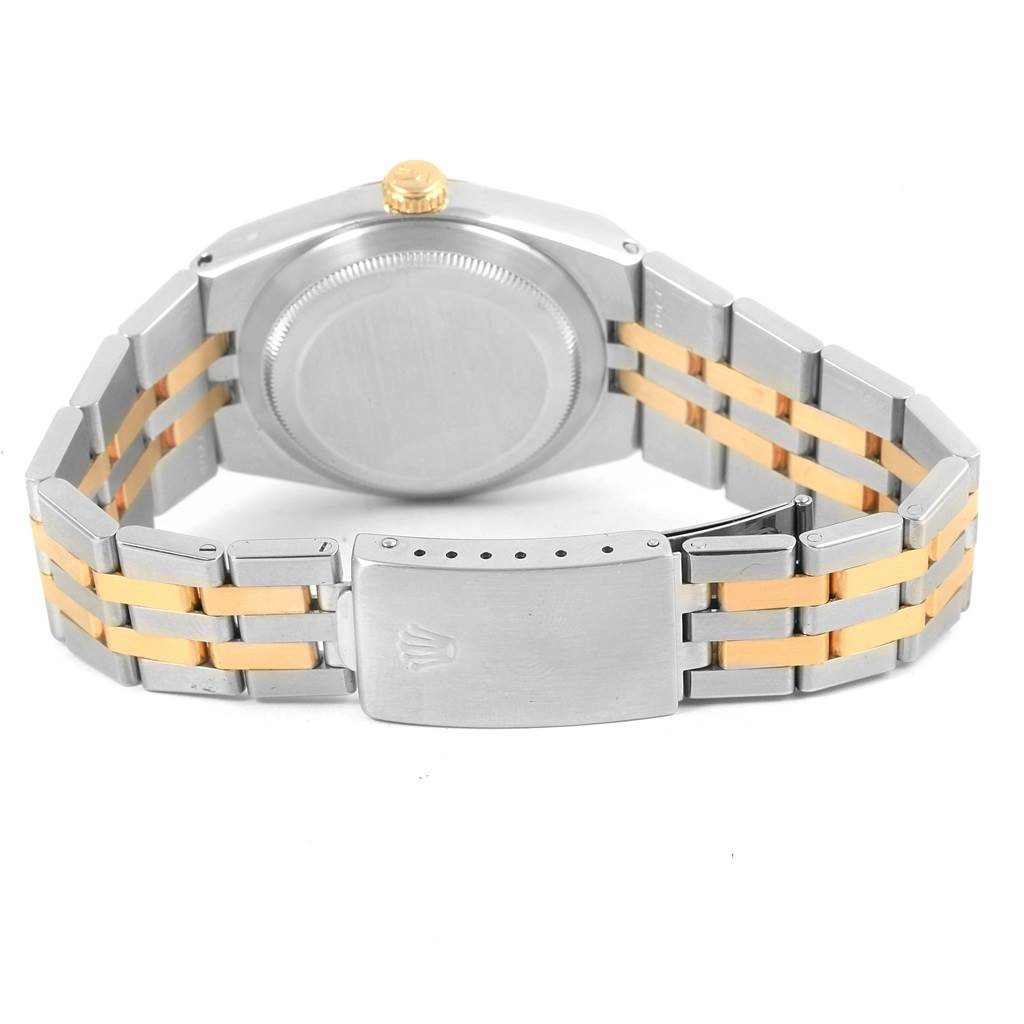 The image shows the back view of a Rolex Oysterquartz 17013 Men's Stainless Steel Champagne Dial 17013 Men's Stainless Steel Champagne Dial watch, highlighting the case back, crown, and two-tone bracelet with the clasp.