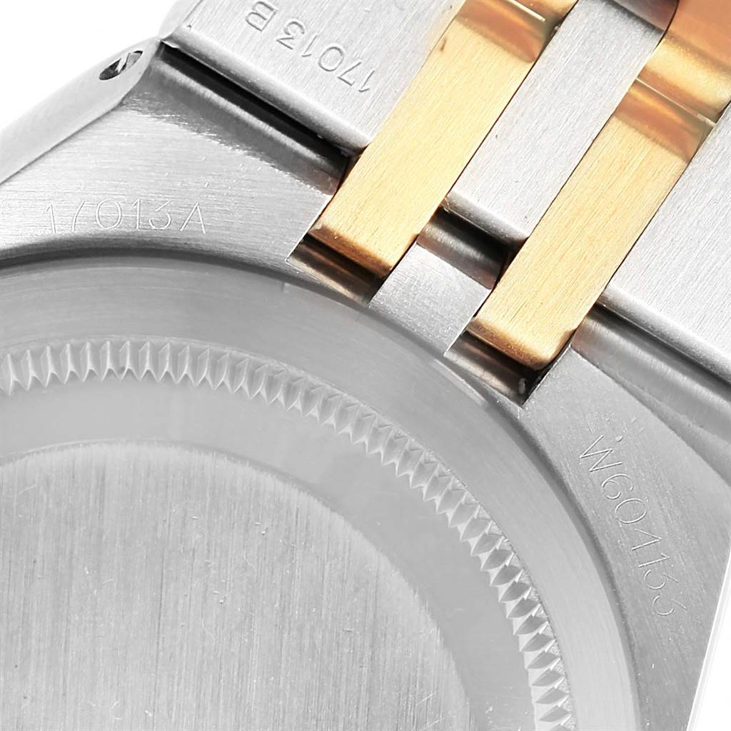 The image shows the case back and bracelet of a Rolex Oysterquartz 17013 Men's Stainless Steel Champagne Dial 17013 Men's Stainless Steel Champagne Dial watch from a close-up angle.