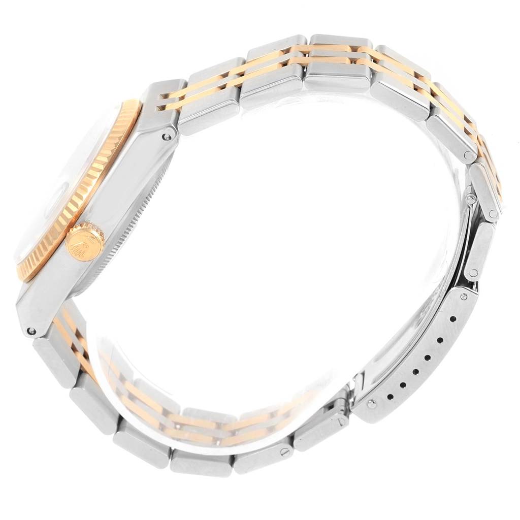 The image shows a side view of a Rolex Oysterquartz 17013 Men's Stainless Steel Champagne Dial 17013 Men's Stainless Steel Champagne Dial watch, highlighting the watch case, crown, and bracelet with a two-tone design.