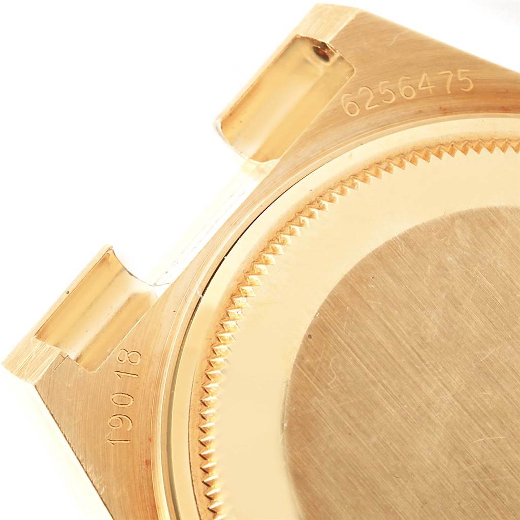 The image shows a close-up of the case back and lugs of the Rolex Oysterquartz 19018 Men's Yellow Gold Black Dial 19018 Men's Yellow Gold Black Dial model, highlighting its serial and model numbers.