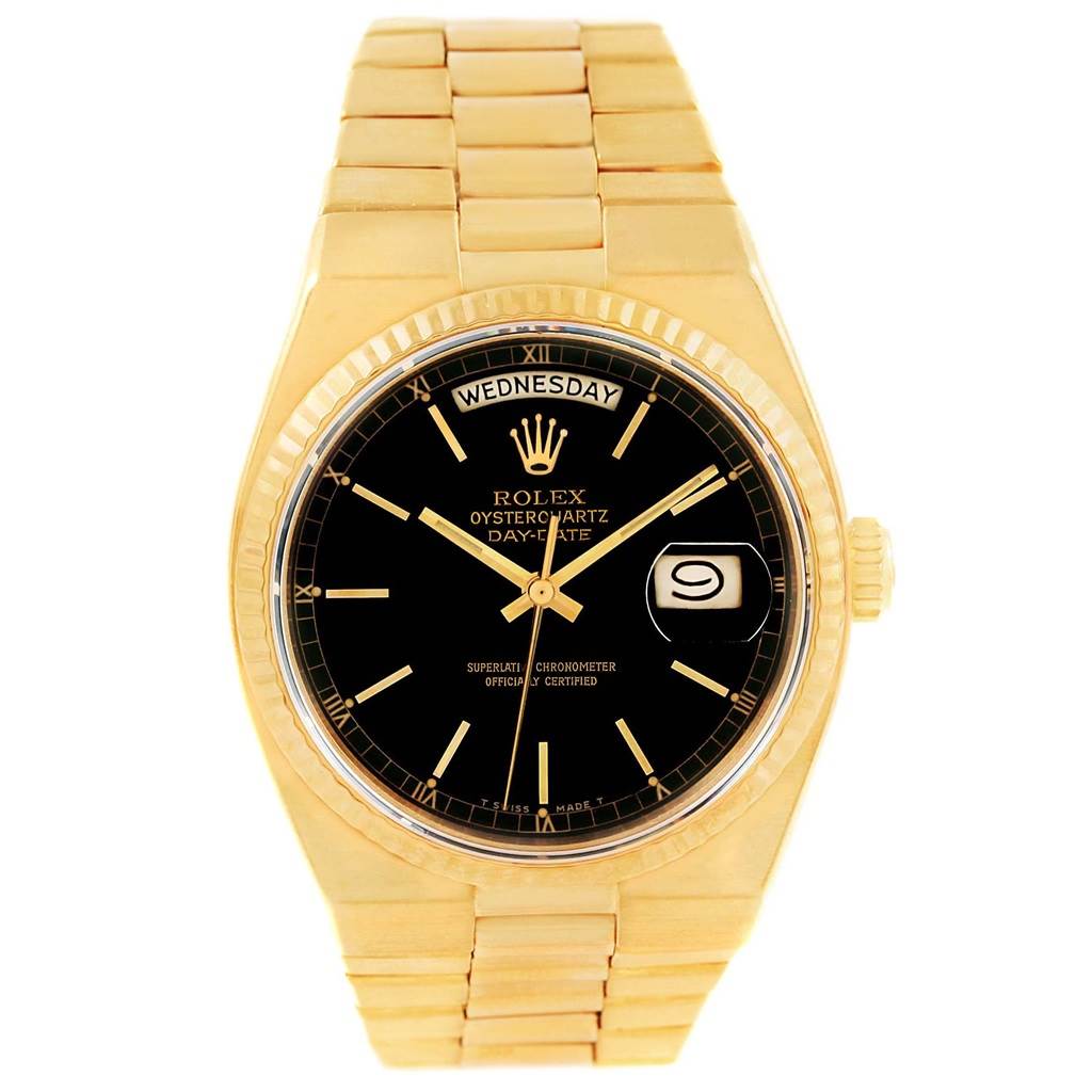 The image shows a head-on view of a Rolex Oysterquartz 19018 Men's Yellow Gold Black Dial 19018 Men's Yellow Gold Black Dial watch, displaying its face, bezel, crown, and part of the bracelet.