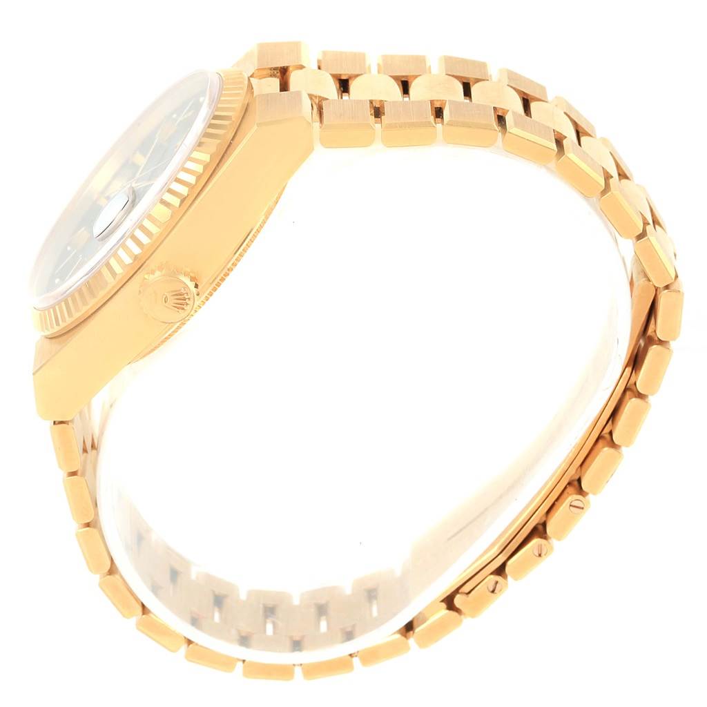 This image shows a side view of the Rolex Oysterquartz 19018 Men's Yellow Gold Black Dial 19018 Men's Yellow Gold Black Dial watch, highlighting its crown, bezel, and bracelet.