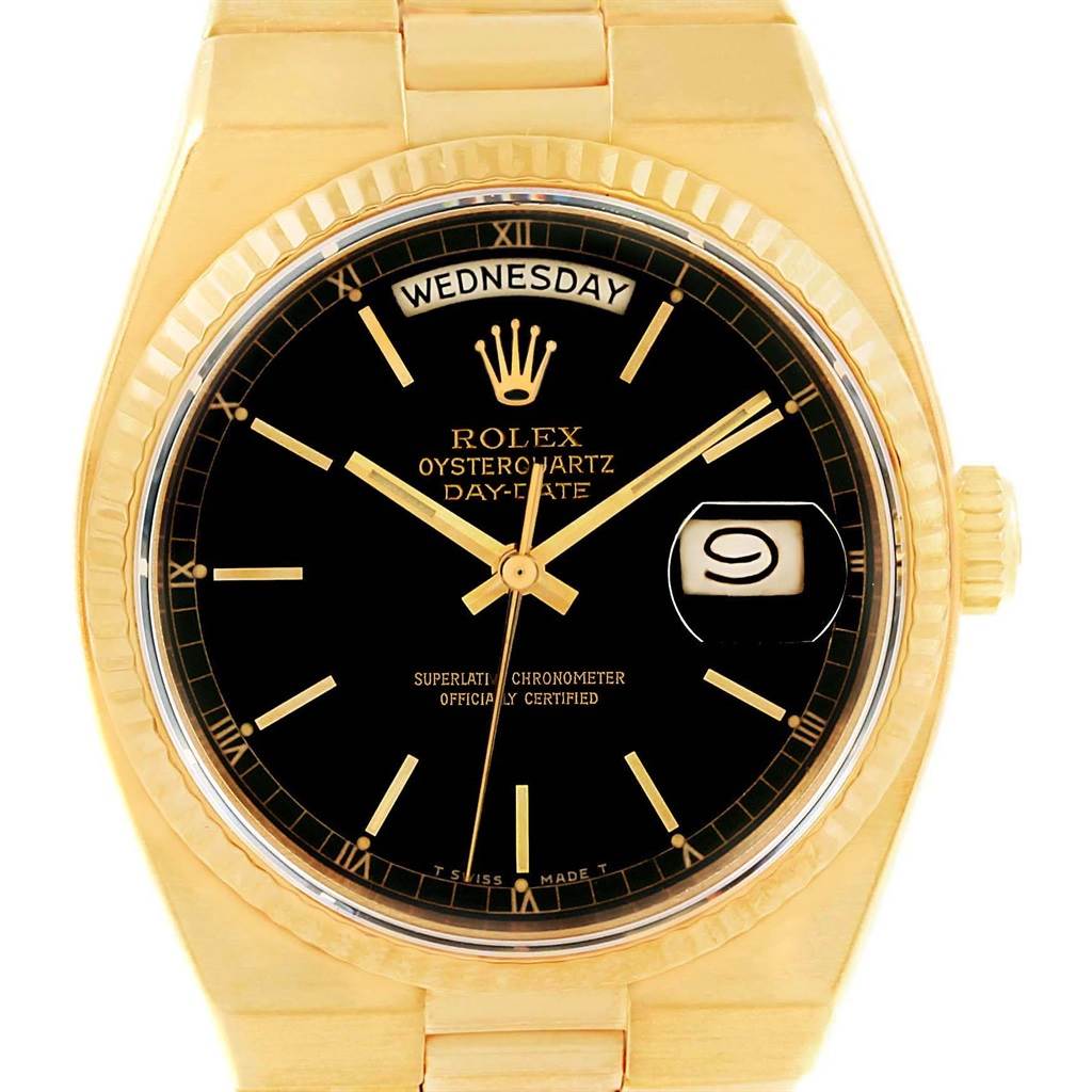 The image shows a frontal view of the Rolex Oysterquartz 19018 Men's Yellow Gold Black Dial 19018 Men's Yellow Gold Black Dial Day-Date watch, highlighting its black dial, date window, and gold case.