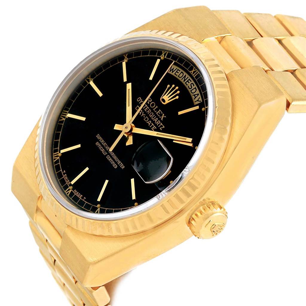 The Rolex Oysterquartz 19018 Men's Yellow Gold Black Dial 19018 Men's Yellow Gold Black Dial watch is shown at an angle displaying the black dial, crown, and part of the bracelet.