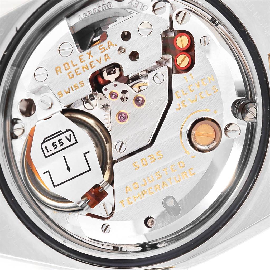 This image displays the inner mechanics and movement of a Rolex Oysterquartz 17013 Men's Stainless Steel Champagne Dial 17013 Men's Stainless Steel Champagne Dial watch, highlighting its components and inscriptions.