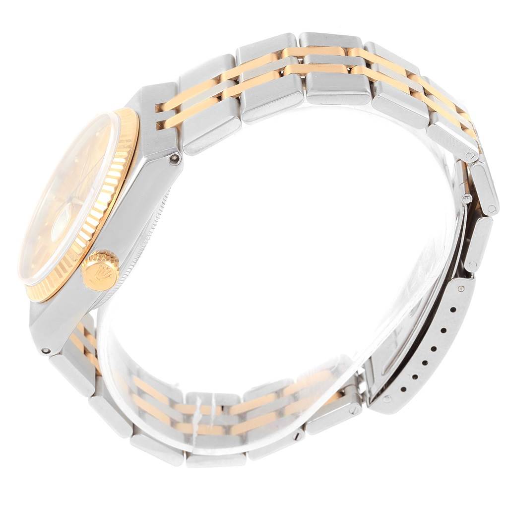 This image shows a side profile of a Rolex Oysterquartz 17013 Men's Stainless Steel Champagne Dial 17013 Men's Stainless Steel Champagne Dial watch, highlighting the crown, bezel, and part of the bracelet.