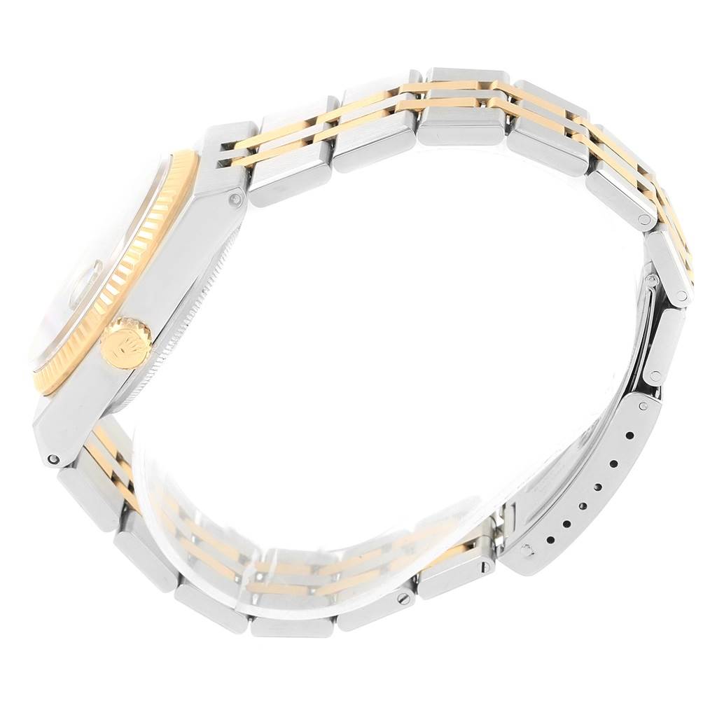 The image shows the side profile of a Rolex Oysterquartz 17013 Men
s Stainless Steel Blue Dial 17013 Men
s Stainless Steel Blue Dial watch, highlighting its bracelet, crown, and part of the case.